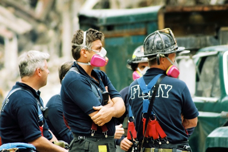 FDNY firefighters rest during recovery operations at Ground Zero, September 27, 2001